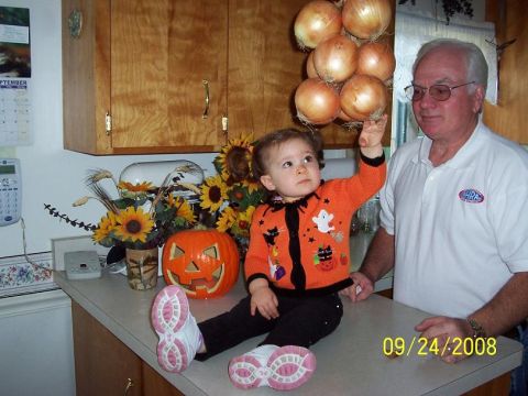 2000 Ford Crown Victoria - A man and a child are in a kitchen with Halloween decorations, dated 09/24/2008.