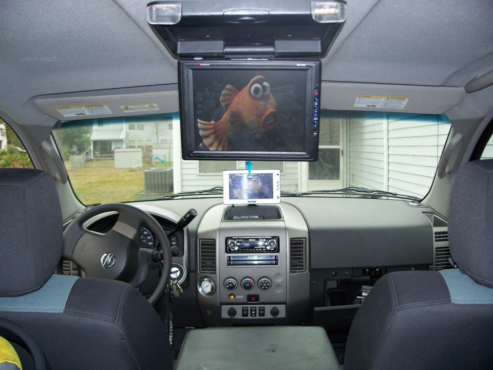 Nissan Titan interior with overhead DVD screen playing a cartoon fish