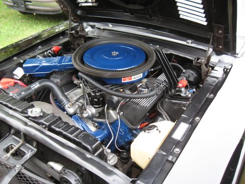 1968 Shelby GT500 - Close-up of a car's engine bay, showing various components and wiring.