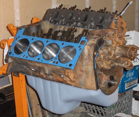 1978 Ford Bronco - V8 engine block with gasket and oil pan, ready for assembly.