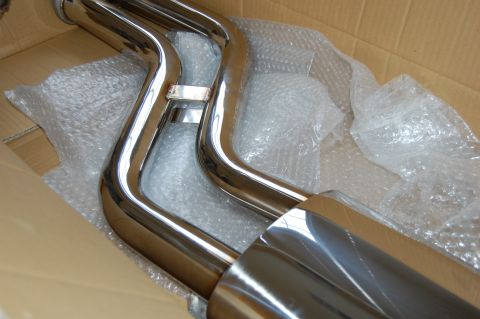 2002 BMW M3 - New exhaust system part, likely for a car, packaged for shipping.