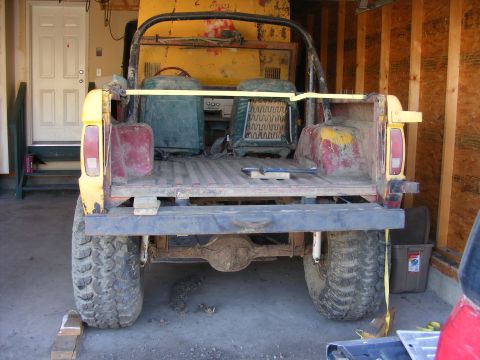 1974 Ford Bronco - This 1974 Ford Bronco is viewed from the rear, showing its build and off-road tires.
