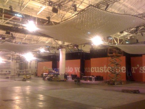 1994 Ford Bronco - An indoor venue is being prepared, with construction equipment and large orange panels visible.