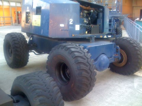 1994 Ford Bronco - This industrial vehicle does not resemble a 1994 Ford Bronco, based on its large tires and utilitarian design.