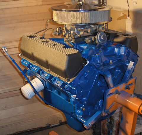 1978 Ford Bronco - Ford V8 engine with chrome air cleaner and black valve covers on an orange engine stand.