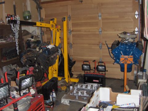 1978 Ford Bronco - Garage scene with two engines, one blue and one black, and an engine hoist.