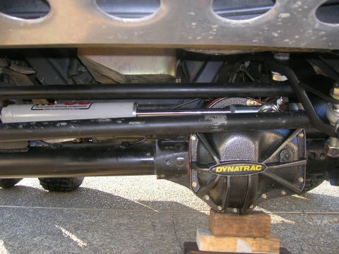 1996 Ford Bronco - Close-up view of the vehicle's steering and differential components, with a Dynatrac cover visible.