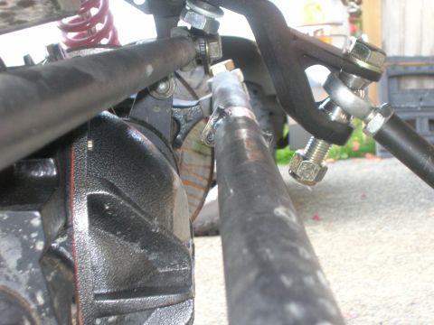 1996 Ford Bronco - Steering linkage and brake caliper assembly detail.