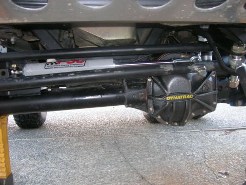1996 Ford Bronco - Close-up of the steering and differential components on a vehicle's undercarriage.