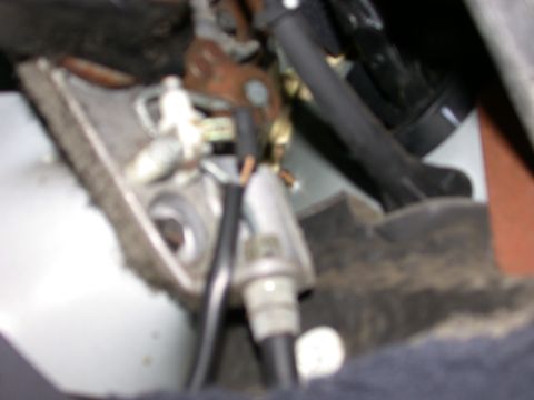 2000 Ford Crown Victoria - The intricate workings of a vehicle's parking brake system are visible in this close-up shot.