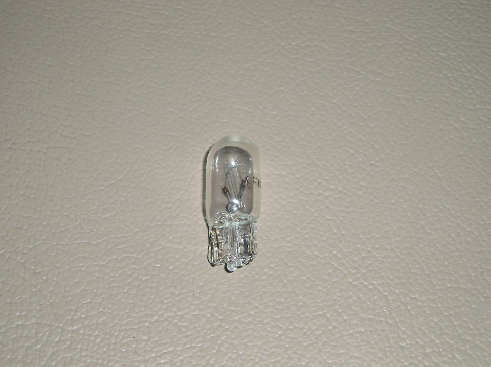 Automotive light bulb with visible filament and markings