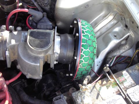 1991 Ford Probe - Close-up of an engine bay an aftermarket air intake system and throttle body.