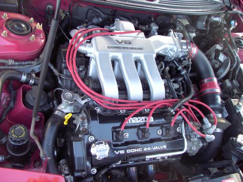 1991 Ford Probe - Close-up of a Mazda V6 engine, highlighting the intake manifold and spark plug wires.