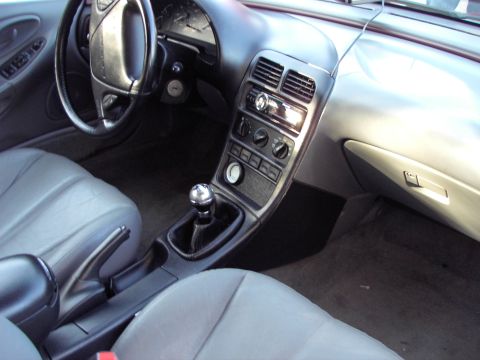 1991 Ford Probe - Interior view of a 1991 Ford Probe, highlighting the dashboard and manual transmission.