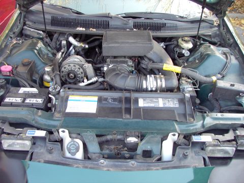1991 Ford Probe - The engine bay of a vehicle, showing various components and wiring.