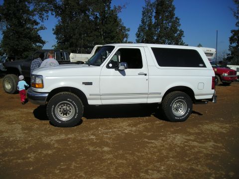 1989 Ford Bronco - This white Ford Bronco is seen from the side, equipped with BFGoodrich All-Terrain T/A tires.