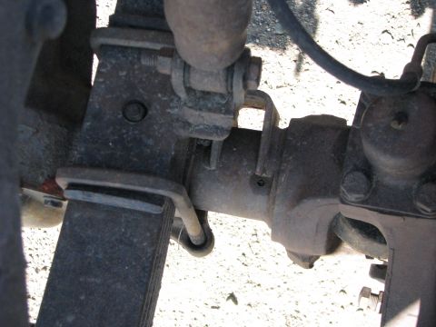 1983 Ford F-250 - Underside view of a truck's suspension system, focusing on the rear axle and leaf springs.