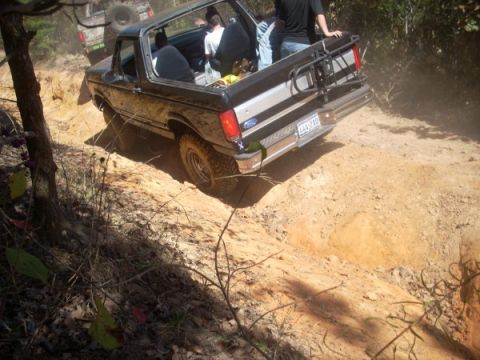 1992 Ford Bronco - This 1992 Ford Bronco navigates a steep dirt incline while another vehicle follows behind.