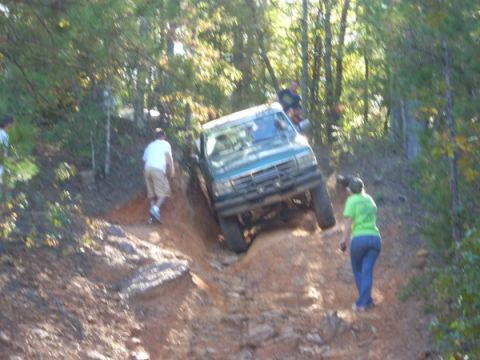 1992 Ford Bronco - Green 1992 Ford Bronco navigates a challenging off-road course.