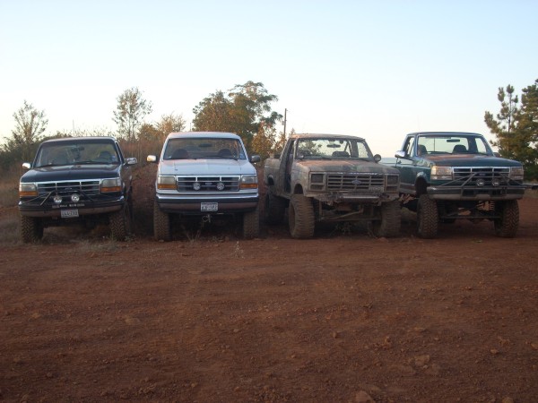1992 Ford Bronco front view, parked with three other trucks