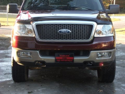 2005 Ford F-150 - This 2005 Ford F-150 features a prominent grille and a Harlem Fire Department license plate.