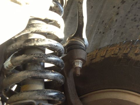 2005 Ford F-150 - This image shows the suspension system of a vehicle, including the coil spring and linkage.