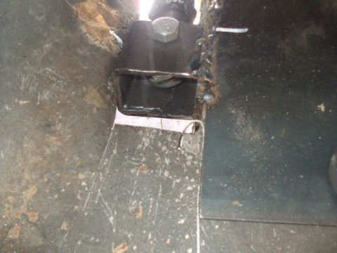1994 Jeep Cherokee - Detail of a welded metal bracket and bolt, showing construction and attachment points.