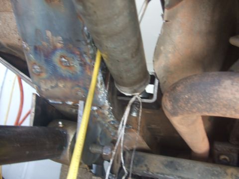 1994 Jeep Cherokee - Underside view of vehicle chassis components, including frame and exhaust system.