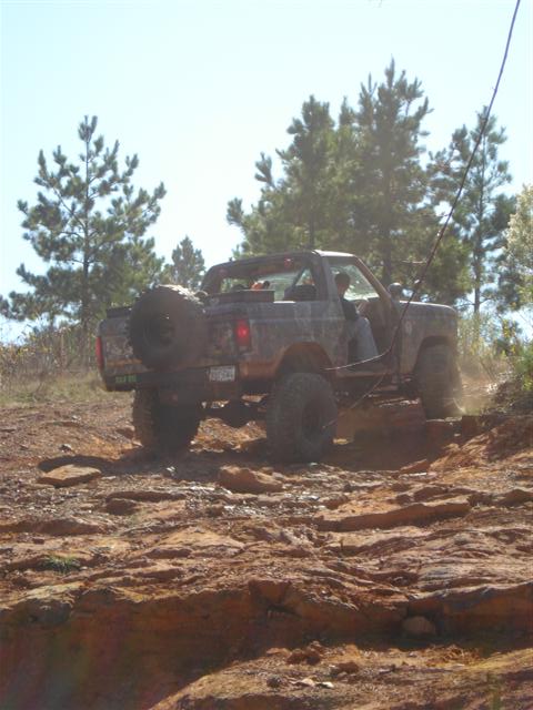 2008 International School Bus - This vehicle navigates a challenging rocky path, demonstrating its off-road capabilities.