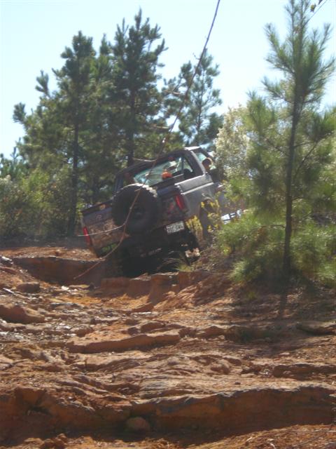 2008 International School Bus - Vehicle struggling on a challenging off-road course.