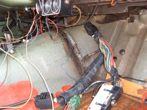 1973 Ford Ranchero - The interior of a 1973 Ford Ranchero shows a complex wiring harness and gauge cluster.
