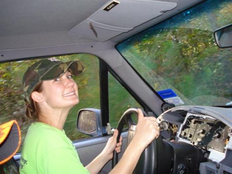 2008 International School Bus - The dashboard of the vehicle is disassembled while the driver looks back.