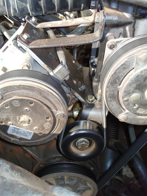 2008 International School Bus - Close-up view of engine components, including a belt tensioner and pulleys.