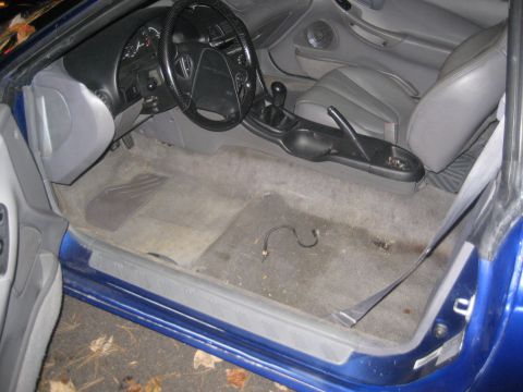 1993 Ford Probe - Interior view of a blue car, highlighting the dashboard, steering wheel, and seats.