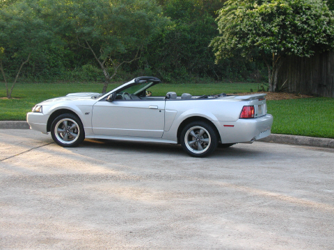 2002 Ford Mustang - This silver convertible Mustang from 2002 is shown from the side view.