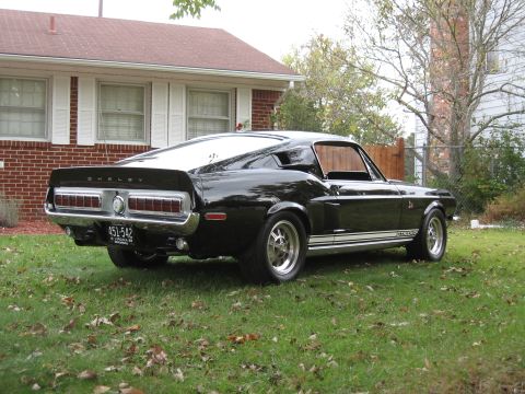 1968 Shelby GT500 - The rear view of a black 1968 Shelby GT500 shows its distinctive taillights and spoiler.