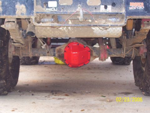 1978 Ford Bronco - A bright red differential cover is visible on the rear axle of a 1978 Ford Bronco, with a date stamp of 02/23/2006 in the corner.