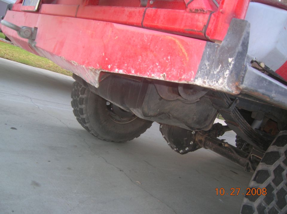 Close-up of a truck's rear axle, fuel tank, and leaf springs. Date stamp reads 10.27.2008