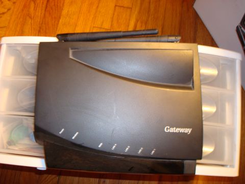 1977 Ford F-100 - A Gateway router is shown on top of a CD storage unit.