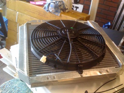 1983 Ford Bronco - An aluminum radiator with an attached black electric fan is shown, with 'CHINA' visible on its side.
