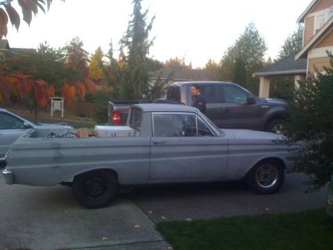 1983 Ford Bronco - A vintage pickup truck is parked in a driveway next to a modern SUV.