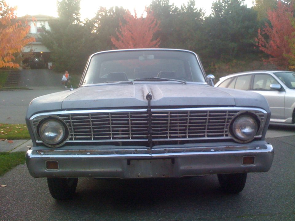 Front view of a 1963 Ford Falcon sedan with a chrome grille
