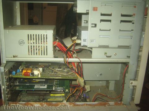 1968 Ford Mustang - Internal components of a computer, including power supply, motherboard, and various cables.