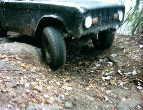 1972 Ford Bronco - Front view of a 1972 Ford Bronco on a dirt path.