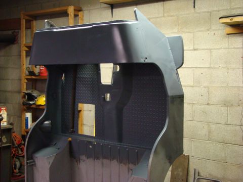 1948 Jeep Wrangler - The body tub of a Jeep CJ-5, likely undergoing restoration, is shown from the interior perspective.