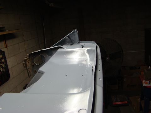 1948 Jeep Wrangler - Primed vehicle body panel in a workshop setting, awaiting further bodywork.