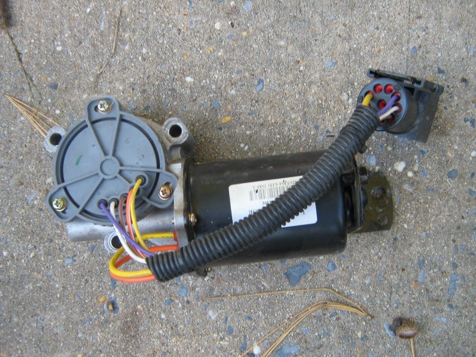 Transfer case motor with wiring harness and connector