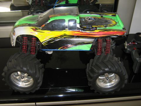 1990 Ford Bronco - This is a remote control monster truck with large tires and bright graphics.