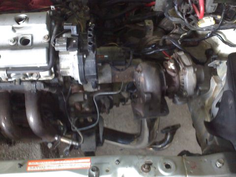 1993 Ford Probe - Close-up view of an engine bay, highlighting the turbocharger and associated components.
