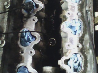 1993 Ford Probe - Close-up view of an engine block, showing gasket material and the SuperMotors.net watermark.